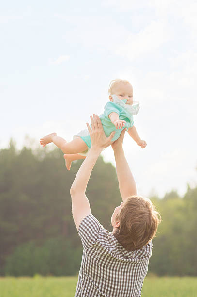 istock Happy father playing with his baby daughter 181059228