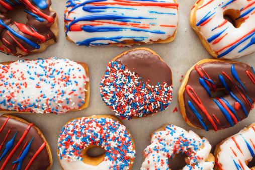 Tray of holiday decorated donuts in a patriotic theme