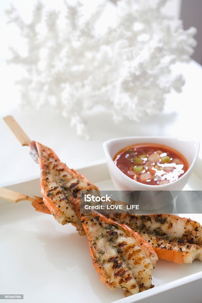 Grilled shrimp satay Grilled shrimp satay and spicy sauce on white background. Appetizer Stock Photo