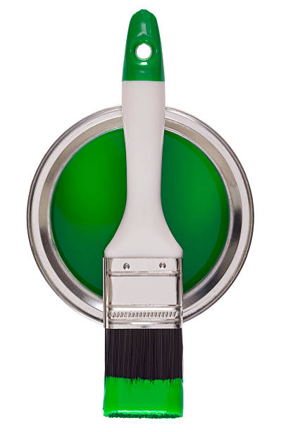 istock Paintbrush on a tin of green paint 181060306