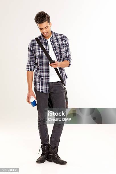Young Casual Man Texting On The Phone Stock Photo - Download Image Now - Full Length, Men, Mobile Phone