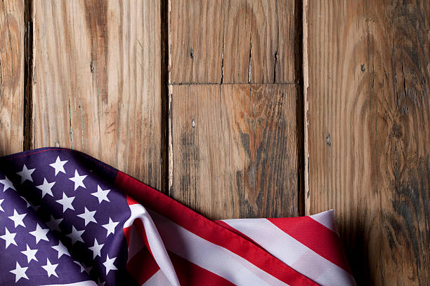 istock American flag on wooden background 181060345