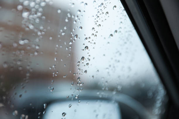 istock Raindrops adorn windowpane, creating a melancholic ambiance, symbolizing solitude, introspection, and nature's serene beauty on a rainy day 1810608044
