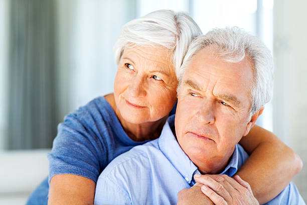 istock Senior Couple Looking Away At Home 181061029