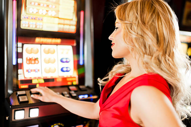 istock Woman gambling on slot machines. 181061200