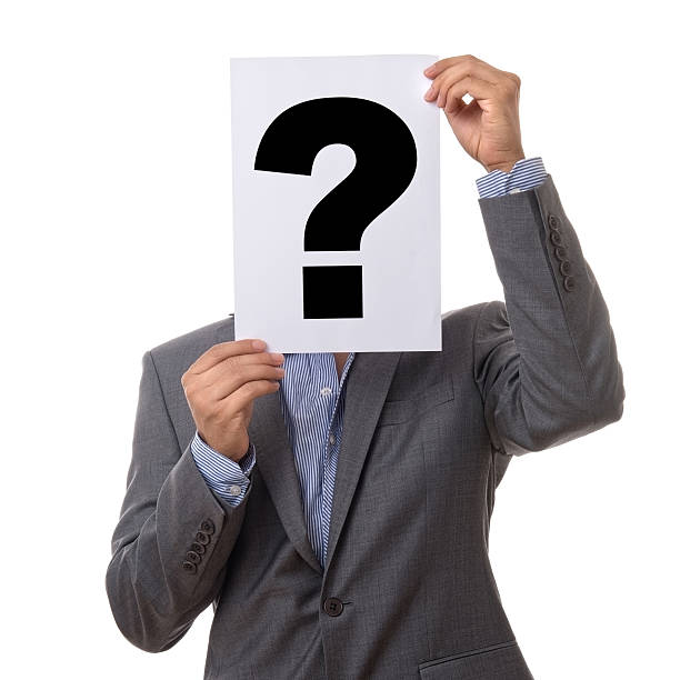 istock Businessman holding a question mark sign 181061221