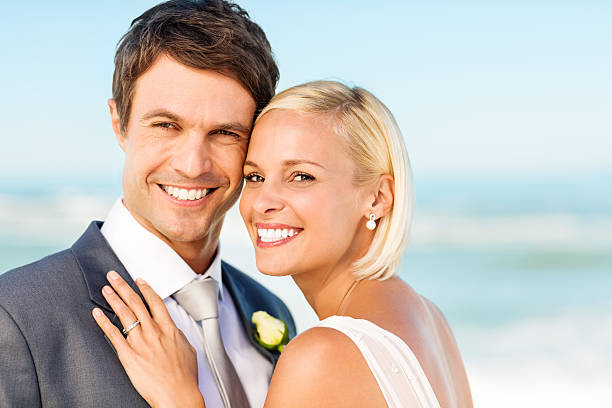 istock Loving Couple Smiling Together On Beach 181061920