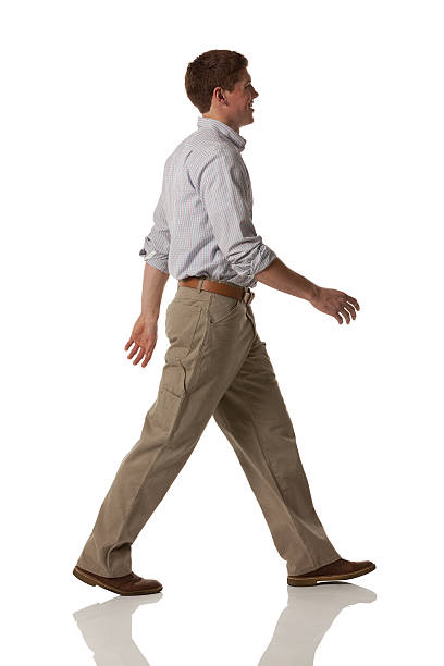istock Profile of a smiling man walking 181062067