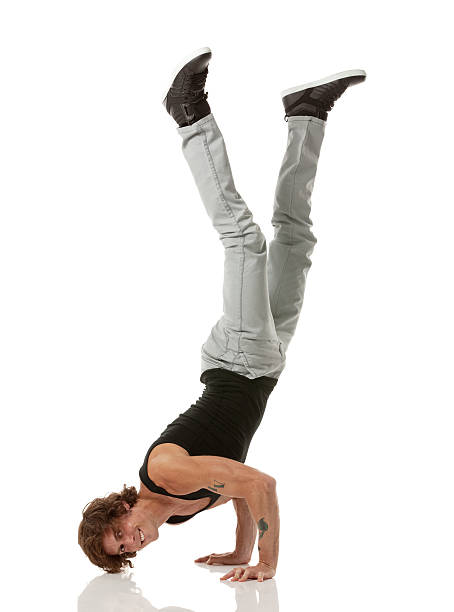 istock portrait of a man doing handstand 181062528