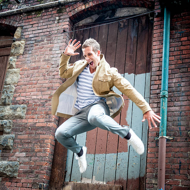 istock Young man jumping off a building 181062651