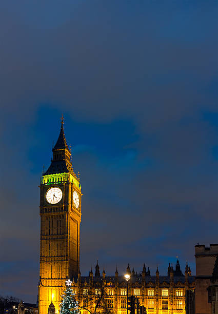 istock Big Ben in London with Christmas tree at dusk 181062914