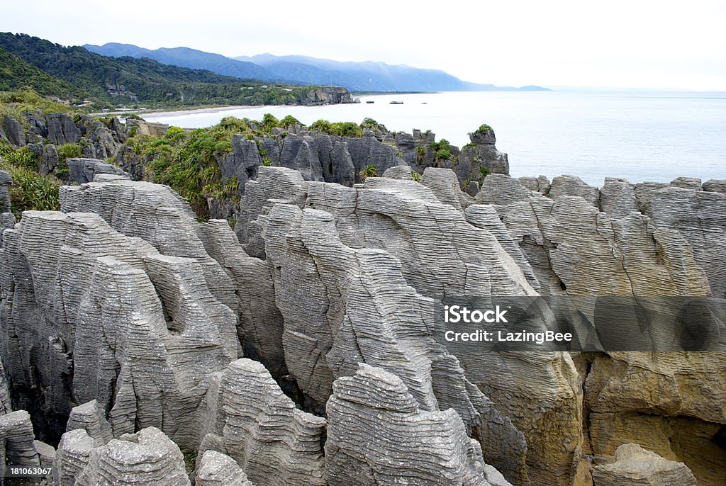 Panqueca Rocks, Punakaiki, costa oeste, Nova Zelândia - Foto de stock de Azul royalty-free