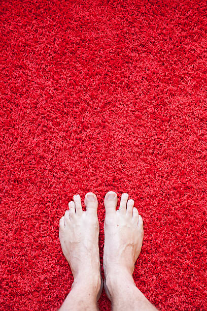 istock Male feet on Red Carpet 181063165