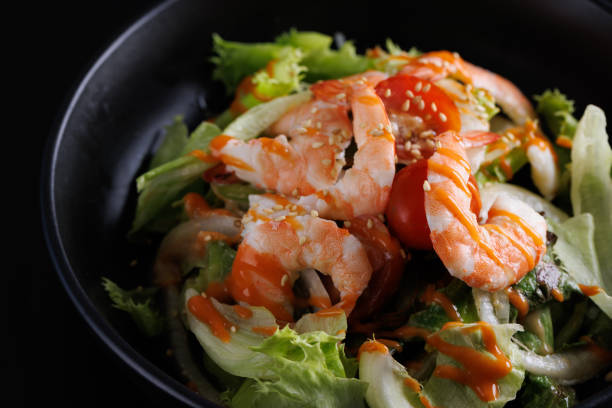 Healthy food concept lunch - rice, shrimp and fresh vegetable salad in one bowl on a light background, top view