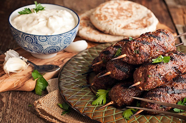 Kofte, Kofta, Middle East Lamb Kababs Lamb kababs with cool sauce and pita kebab photos stock pictures, royalty-free photos & images