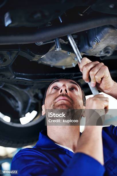 Focused On The Task At Hand Stock Photo - Download Image Now - 30-39 Years, Adjusting, Adult
