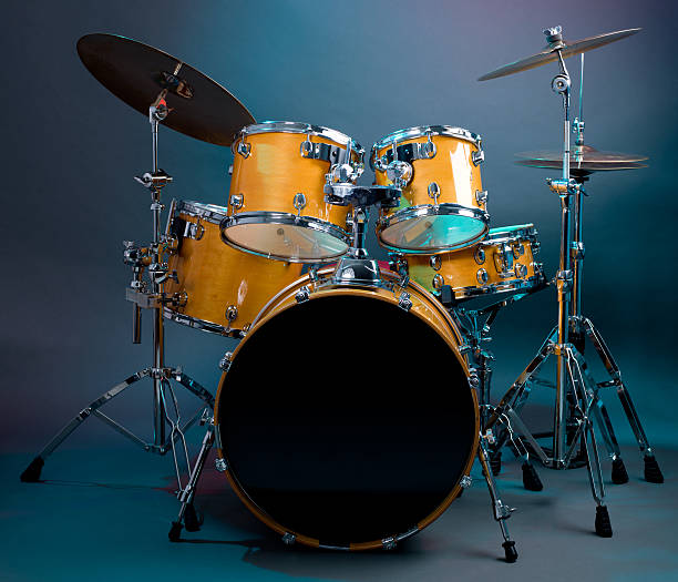 Drum Kit Set of yellow drums isolated on black background. bass drum photos stock pictures, royalty-free photos & images