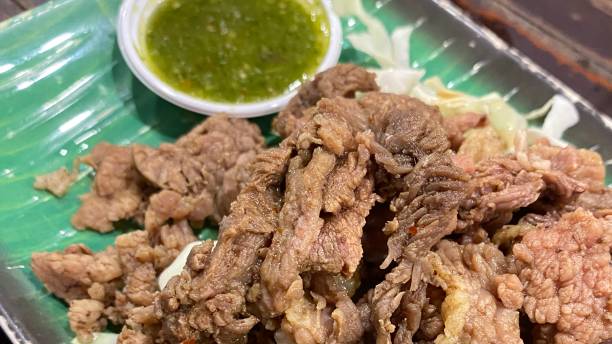 Boiled beef with dip This is boiled fatty meat with dipping sauce. Eat with seafood dipping sauce. Must try. ARPA stock pictures, royalty-free photos & images