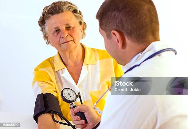 Young Doctor With Patient Stock Photo - Download Image Now - 60-69 Years, Adult, Adults Only