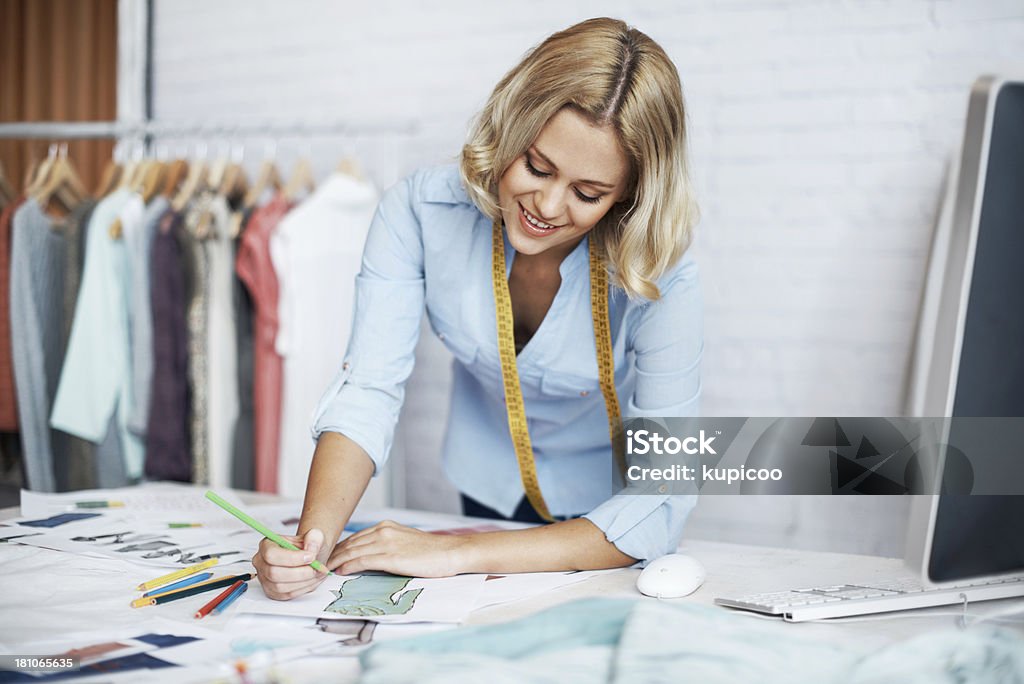 Working on a new concept A young designer creating a design on paper Adult Stock Photo