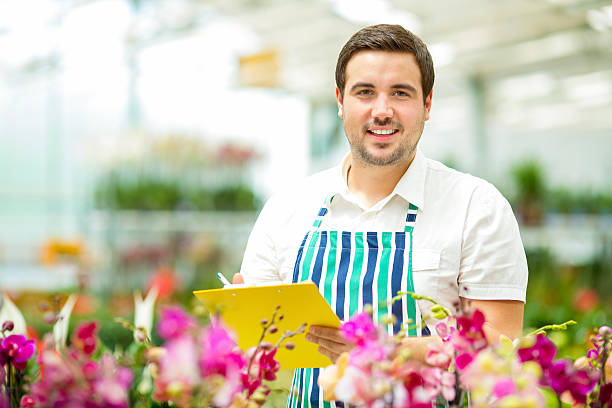 istock Male Florist Working At Garden Center. 181065993