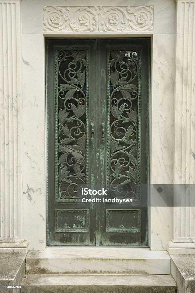 Mausoleum entrance Doors to a mausoleum Cemetery Stock Photo