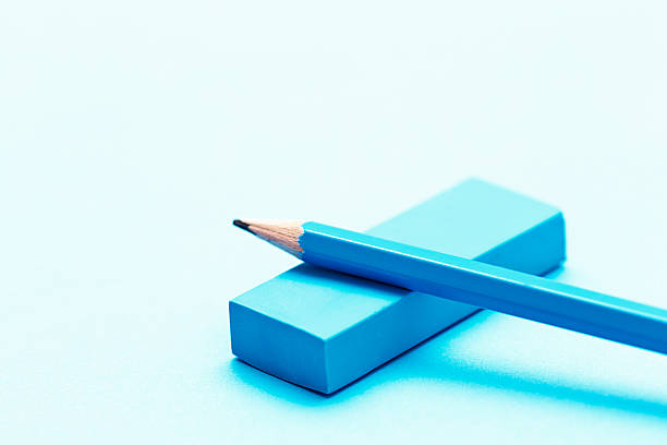 istock Turquoise pencil and eraser on shaded blue background 181066344
