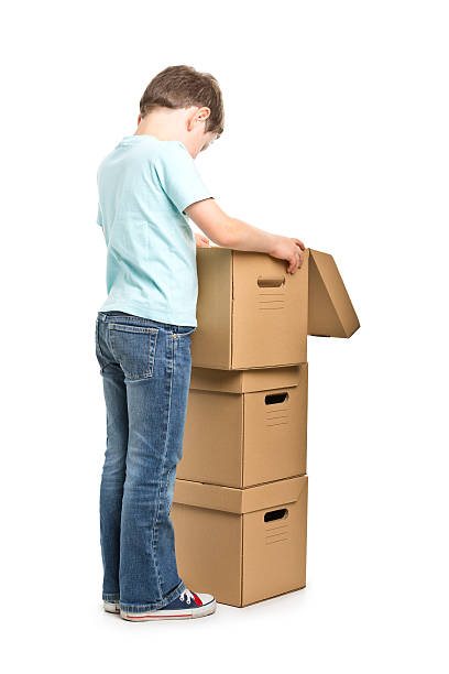 istock portrait of small boy with boxes 181066605
