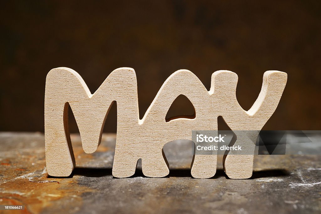 May: Month of the Year Single word MAY,  hand cut from wood. Alphabet Stock Photo