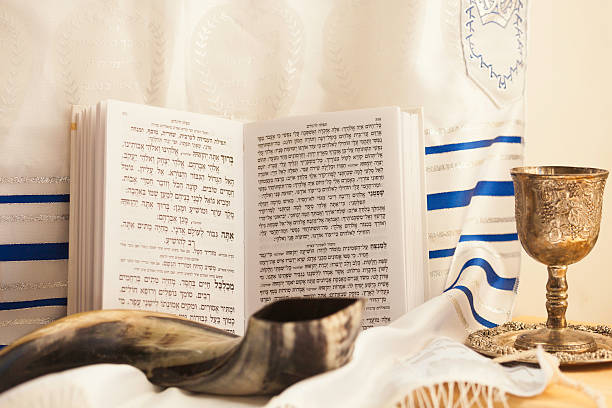 Rosh Hashana theme Shofar, kiddush cup with wine,prayer book and talit for The Jewish new year. yom kippur stock pictures, royalty-free photos & images