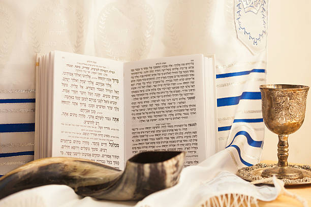 Shofar, kiddush cup with wine,prayer book and talit for The Jewish new year.