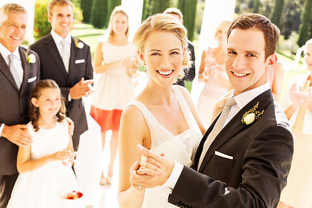 istock Bride and Groom Dancing With Wedding Guests Applauding In Background 181066954