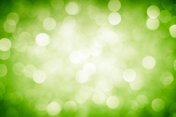 istock A blurred out background of green sparkles 181066990