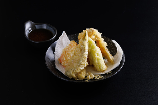 Mix tempura with shrimp fish and vegetable Japanese food isolated in black background