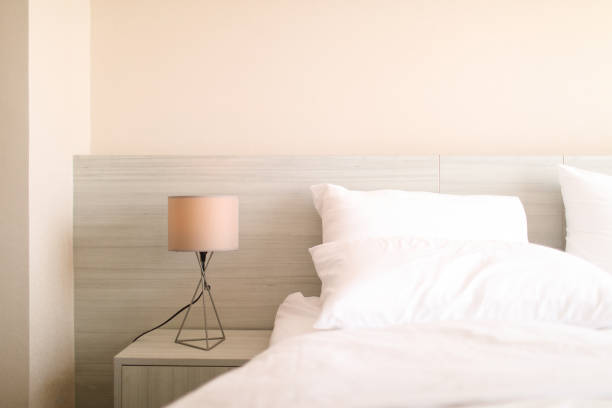 istock bed in a modern white tone loft room 1810677260