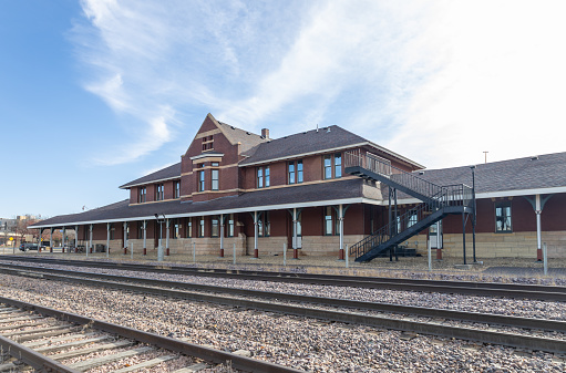 Mankato, Minnesota, USA - November 19, 2023: View of the Mankato Union Depot, a historic passenger railway station built in 1896 by the Chicago and North Western Railway. The architect and builder was J. B. Nelson & Co. The building no longer serves as a passenger station, instead housing local shops and businesses. It was listed on the National Register of Historic Places in 1980.