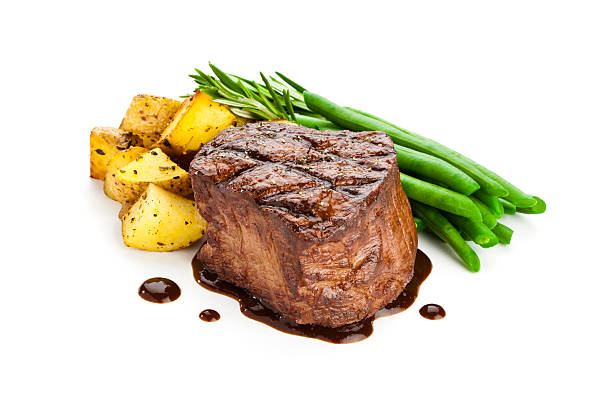 Filet Mignon with Potatoes and Green Peas Isolated on White Background.