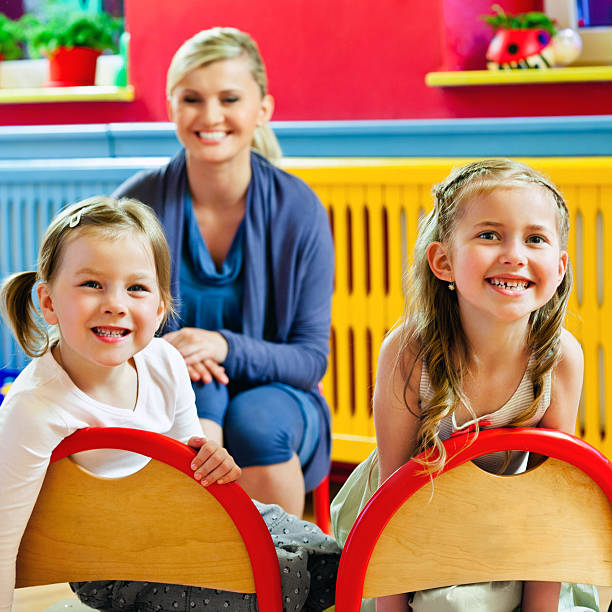 istock Cute girls in a Nursery School 181069234