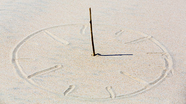 Sun clock Sun clock in beach sand. ancient sundial stock pictures, royalty-free photos & images