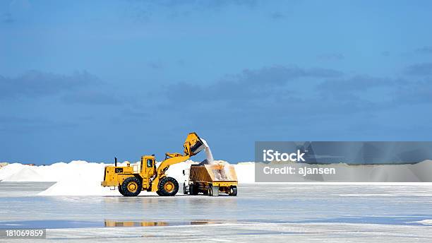 Caterpillar At Work On Salt Flat Bonaire Stock Photo - Download Image Now - Bonaire, Salt - Mineral, Blue