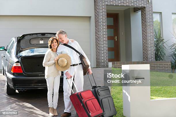 Mature Couple With Suitcases And Car Stock Photo - Download Image Now - Car, Driveway, House