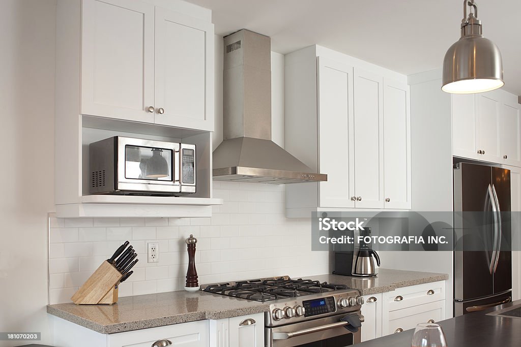 Domestic Kitchen Interior of brand new kitchen in North American residence. Cabinet Stock Photo