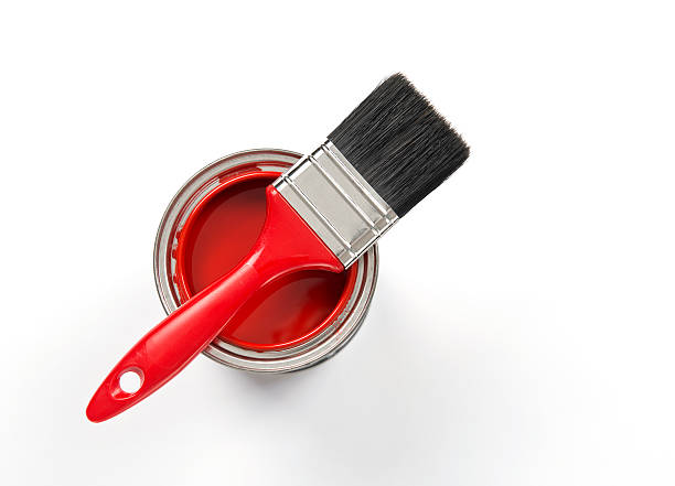 istock Paintbrush with red paint on a can 181070227