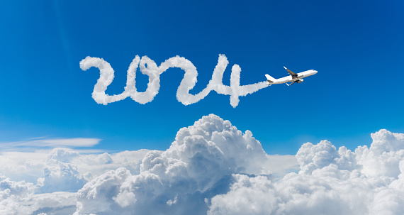 The plane writing new year number 2024 in the sky