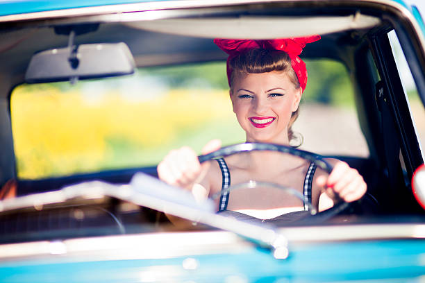 istock Pin-up girl in car 181070409