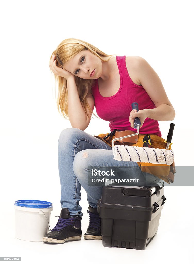 Home renovation frustration Woman frustrated with DIY home renovation project, isolated on white Adult Stock Photo