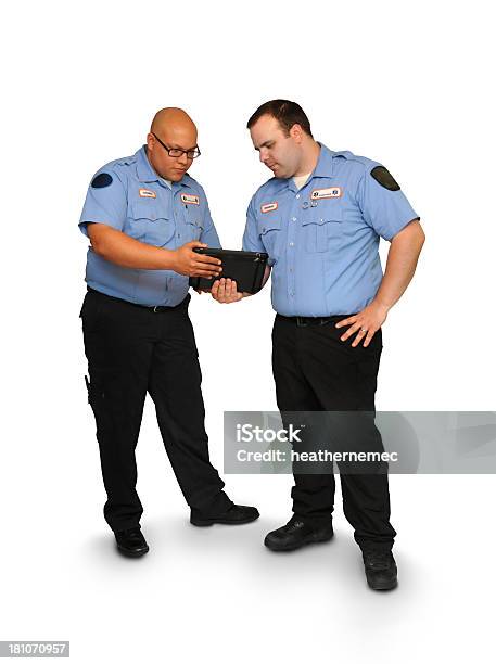 Paramedics Su Un Tablet - Fotografie stock e altre immagini di Accudire - Accudire, Adulto, Adulto di mezza età