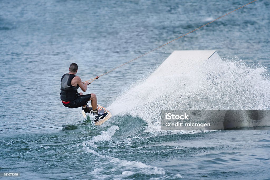 Wakeboarding Aggressive wakeboarding ride Adult Stock Photo
