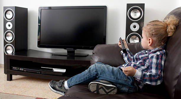 istock Blond hair boy watching TV. 181071425