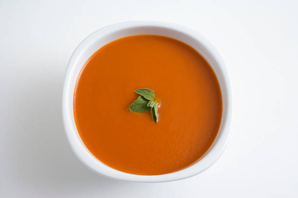 Tomato Soup Tomato Soup. Macro, shallow focus. bowl of soup stock pictures, royalty-free photos & images